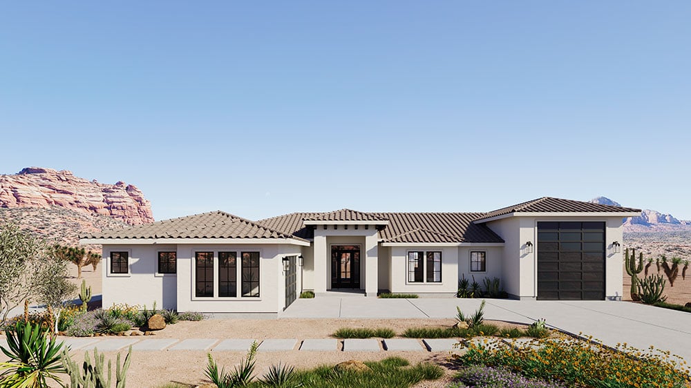 Single-story desert home with light stucco exterior, clay tile roof, and xeriscape landscaping amid red rock formations and cacti.